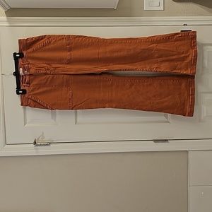 Rust colored flare jeans